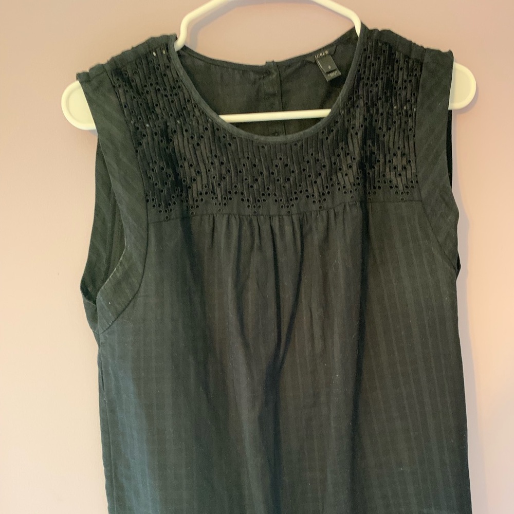 black tank top with details.